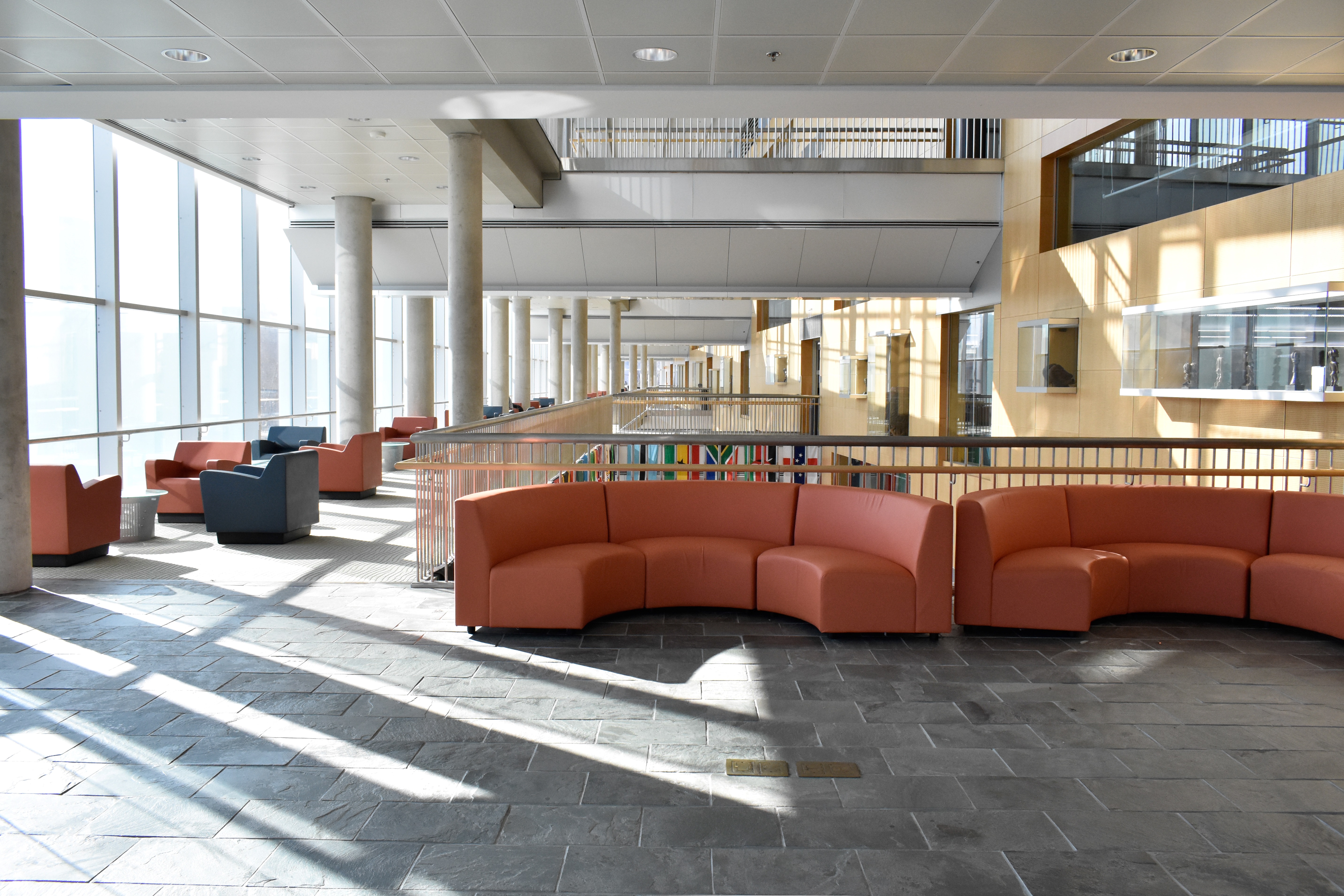 semicircle couches, with a row of study chairs in the background, sitting on second floor overlook