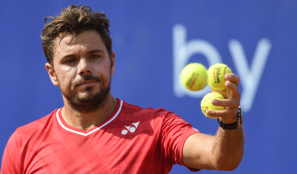 Stan Wawrinka collecting balls