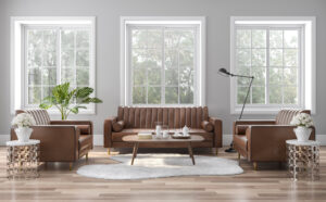 The vintage style living room is decorated with brown-orange leather sofas 3D render. The rooms have wooden floors and gray walls, with white windows offering natural views.