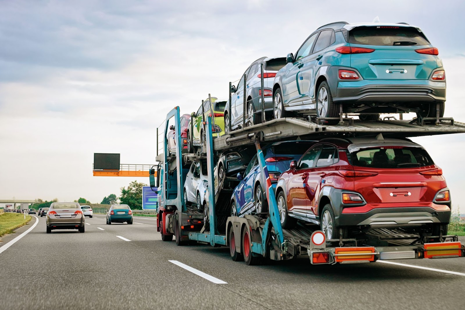 Car transporter carries new vehicles