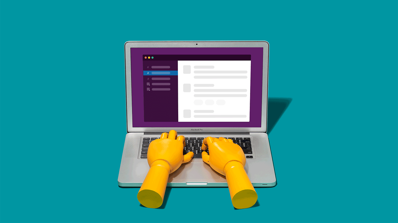 hands typing on a computer showing the Slack app representing using Slack