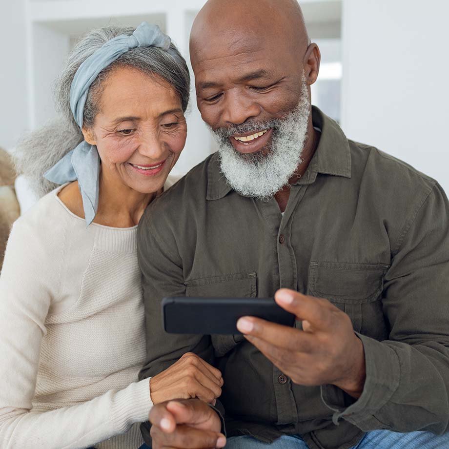 Two people looking at a smartphone