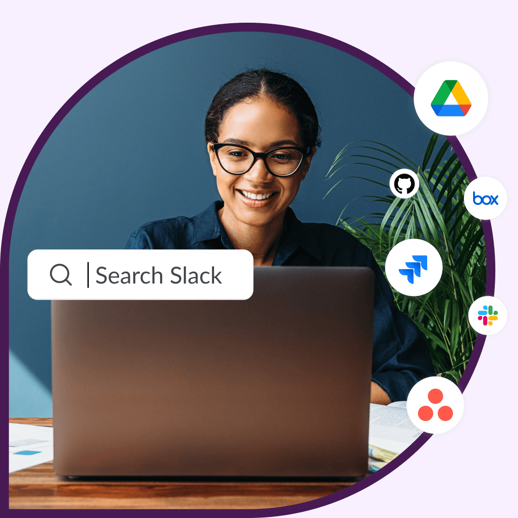 A female employee wearing glasses smiles as she uses Slack's new enterprise search function.