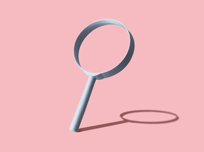 Magnifying glasses on a pink background