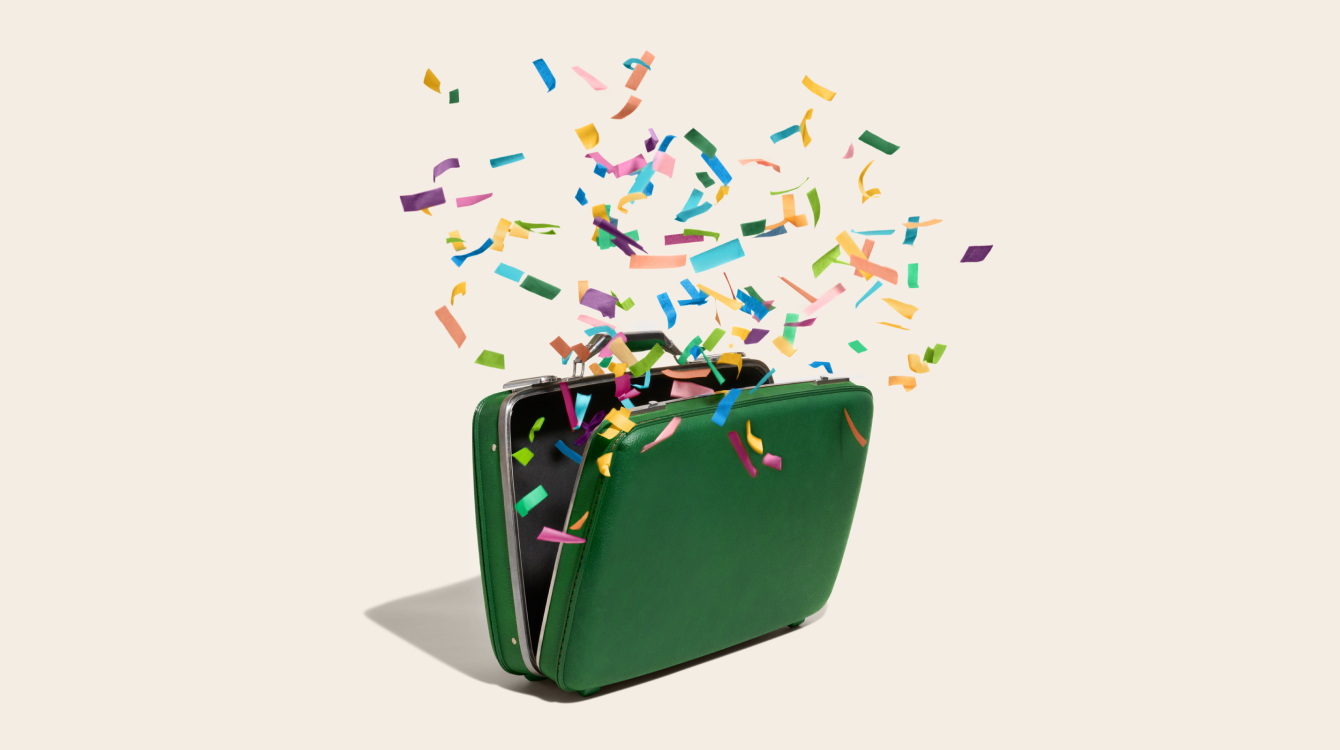 Brief case with confetti coming out representing sales