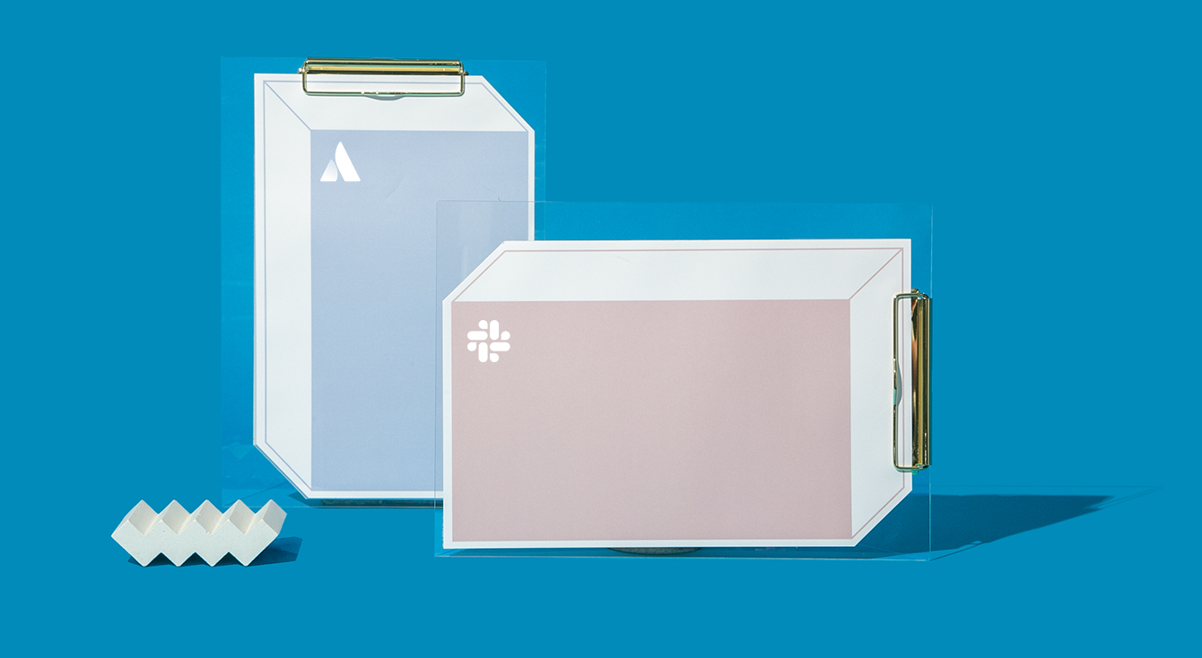 Slack & Atlassian logos on boxes with clipboards