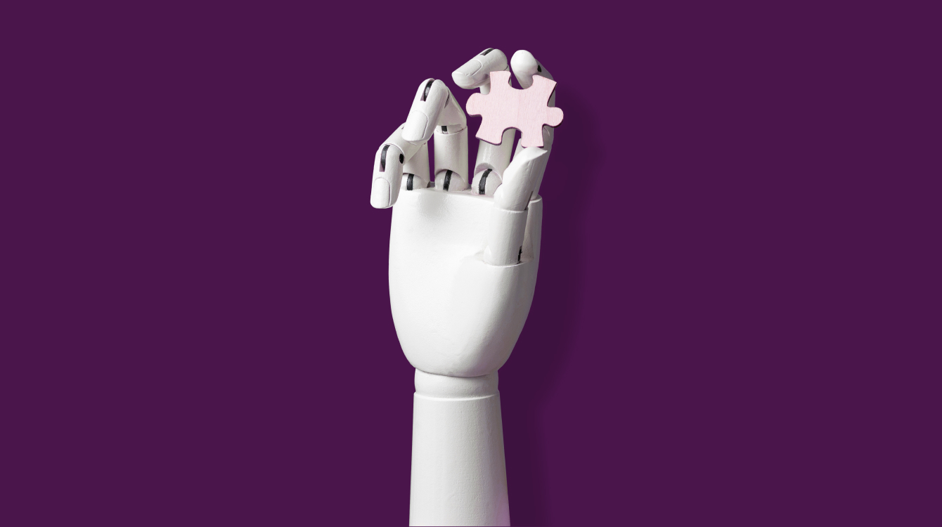 Robot hand holding puzzle piece representing the state of work and future