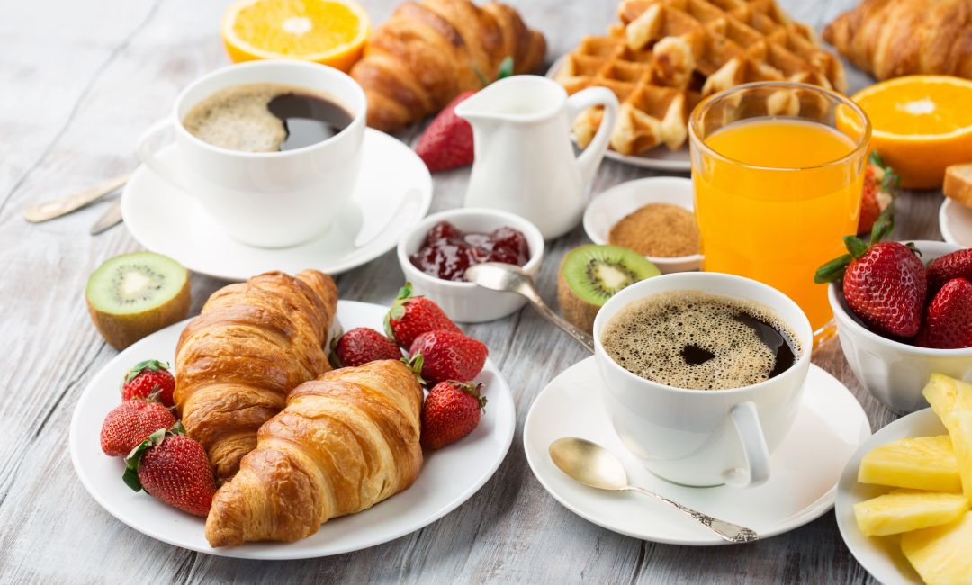 A Table With Breakfast Items