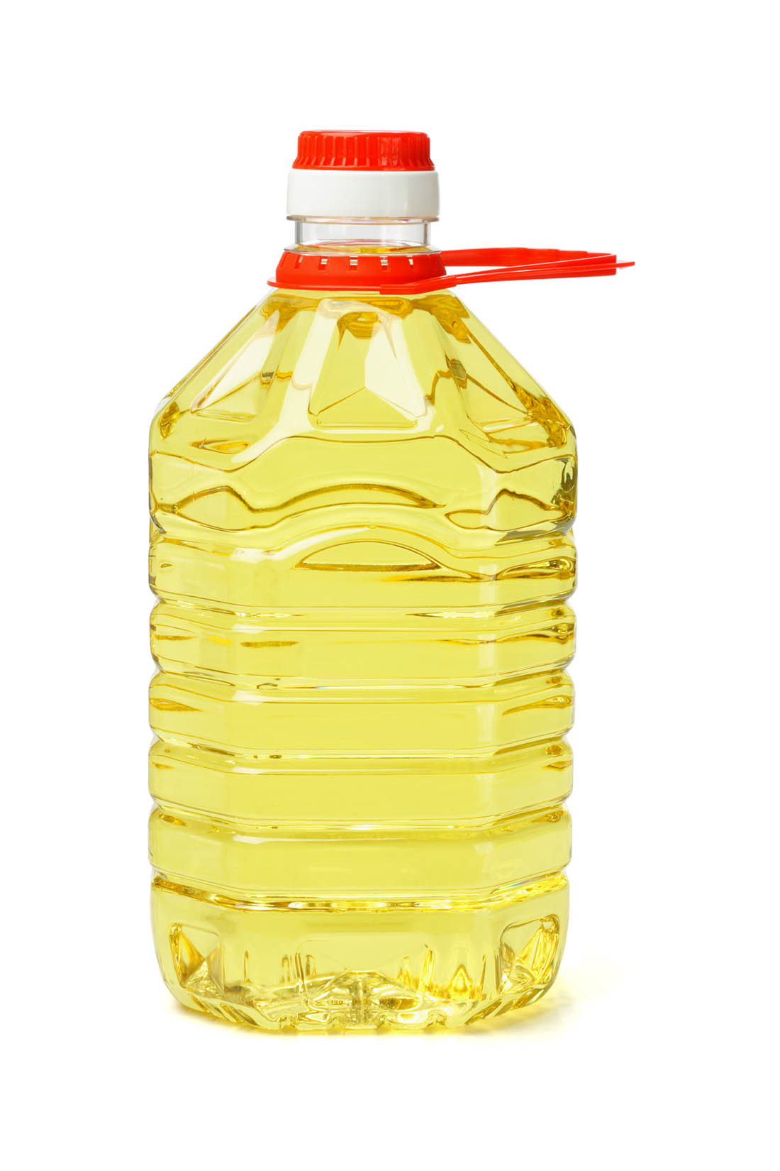 Plastic bottle of canola oil. Canola oil is a source of cooking oil, margarine, salad dressing and shortening.
