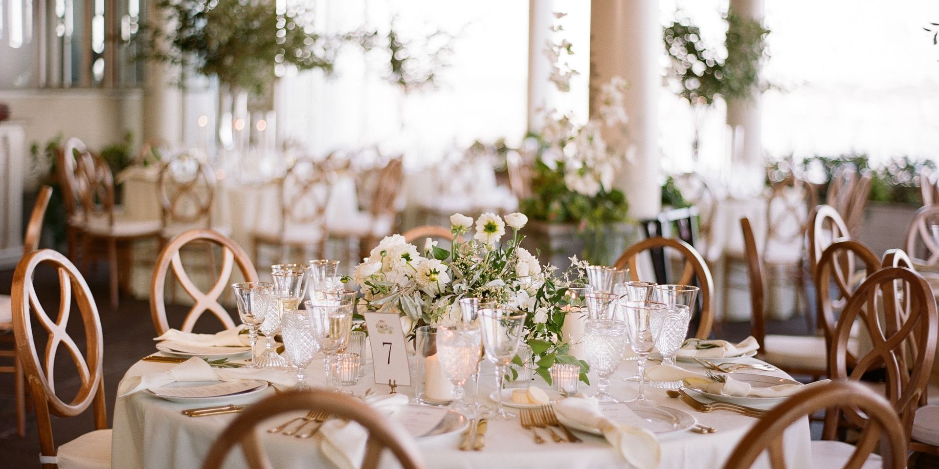 A Dining Room Table In Front Of A Window