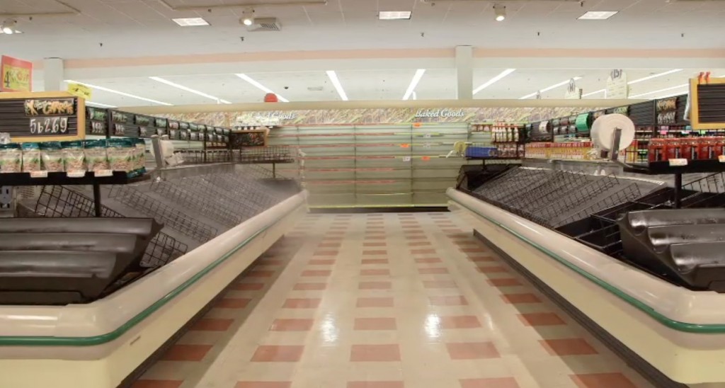 Entire aisles remain empty at this Market Basket store in Tewksbury, Mass. NewsHour still photo.