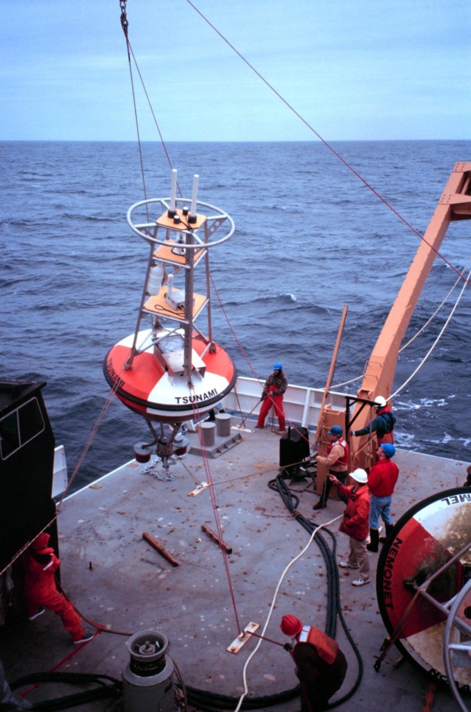 NOAA deploys a buoy in the Pacific Ocean to send real-time sea level data to tsunami warning centers. Courtesy: NOAA