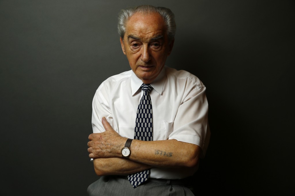 Auschwitz concentration camp survivor Marian Majerowicz poses for a portrait in Warsaw