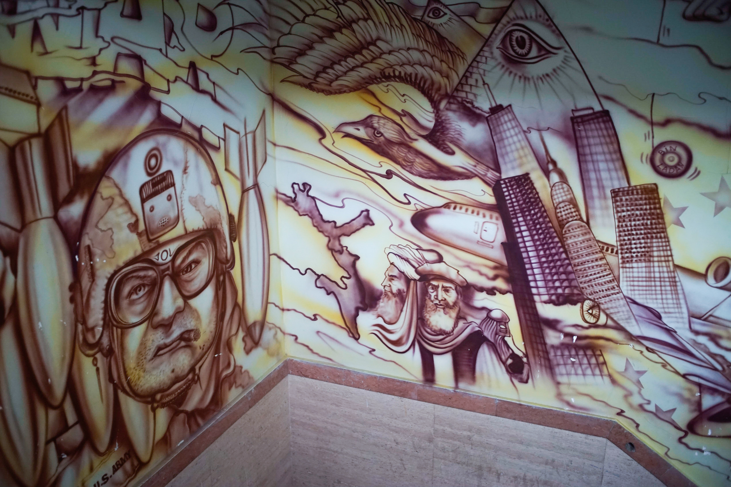 More detail of the murals leading up to the museum floor, including one which portrays a part of the conspiracy theory that 9/11 was engineered by the U.S. and Israel to help justify invading the Middle East. (Our tour guide affirmed his belief in this conspiracy, along with several others.)
