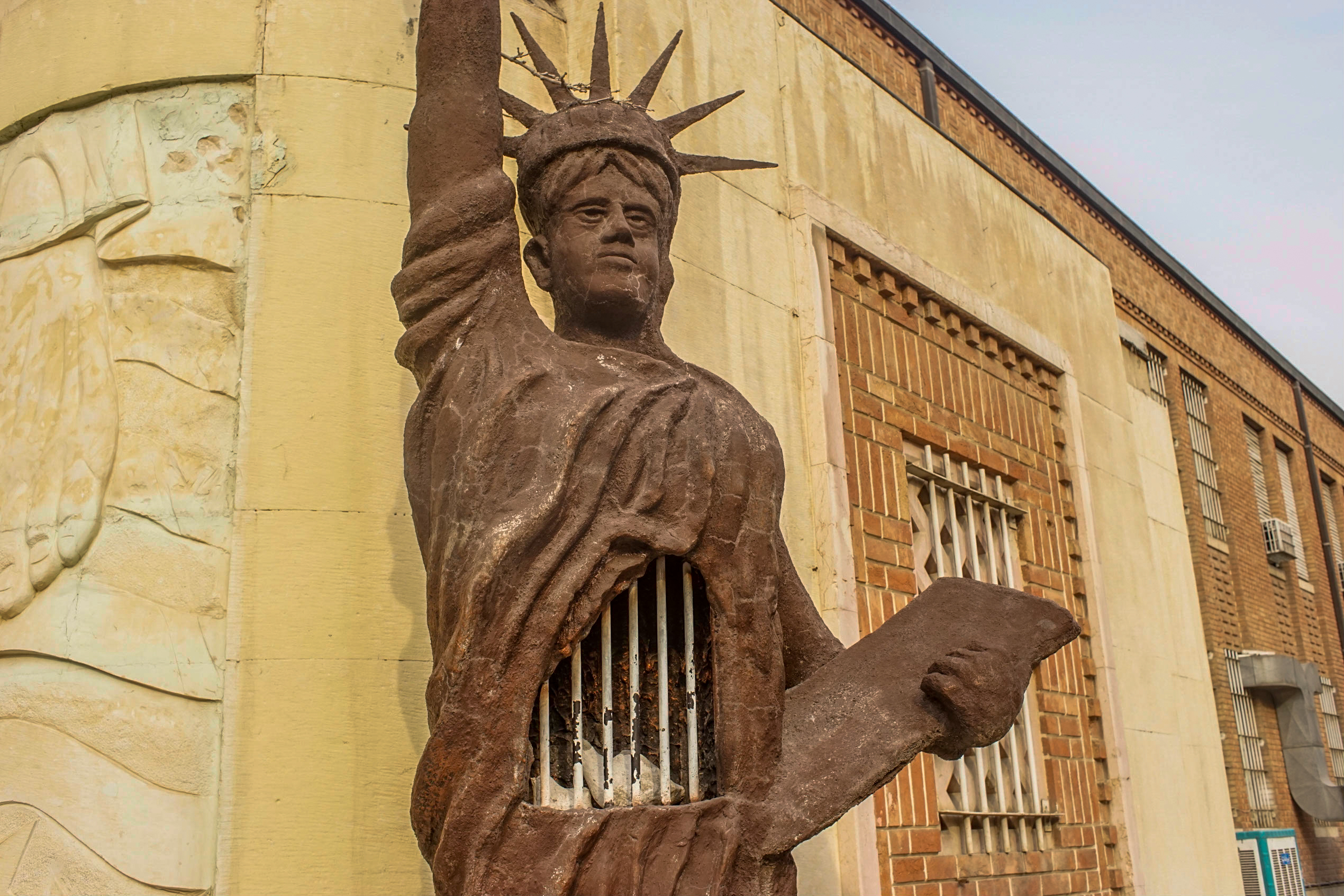 The second anti-American statue outside the main entrance. Here, the Statue of Liberty’s gown opens to reveal two imprisoned white birds. 