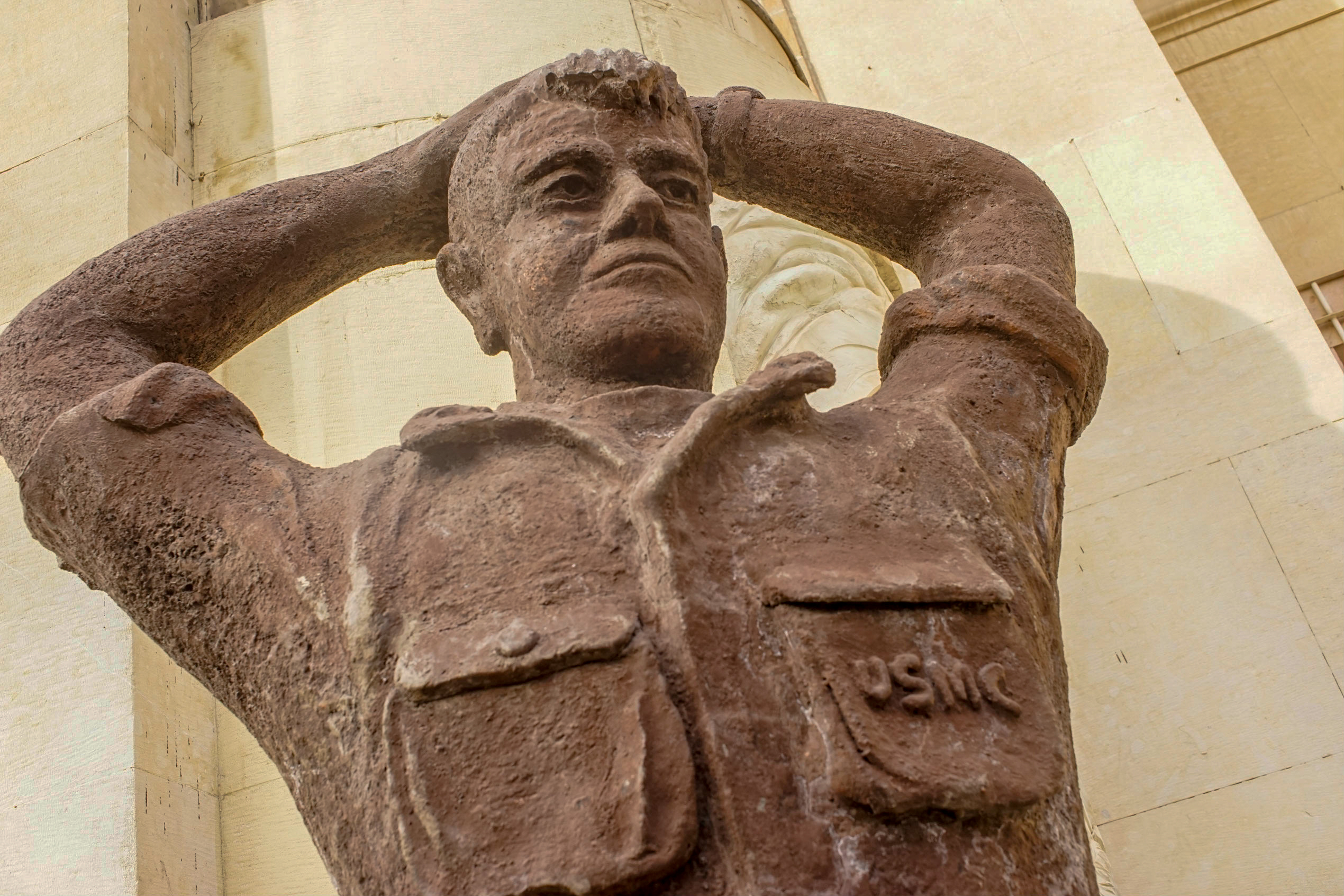 One of two plaster statues outside the main embassy building. This one of a U.S. Marine seems to be copying the image of captured Marine Corporal Steve Kirtley, who was one of the Marines stationed at the embassy in 1979, and was photographed with other hostages.