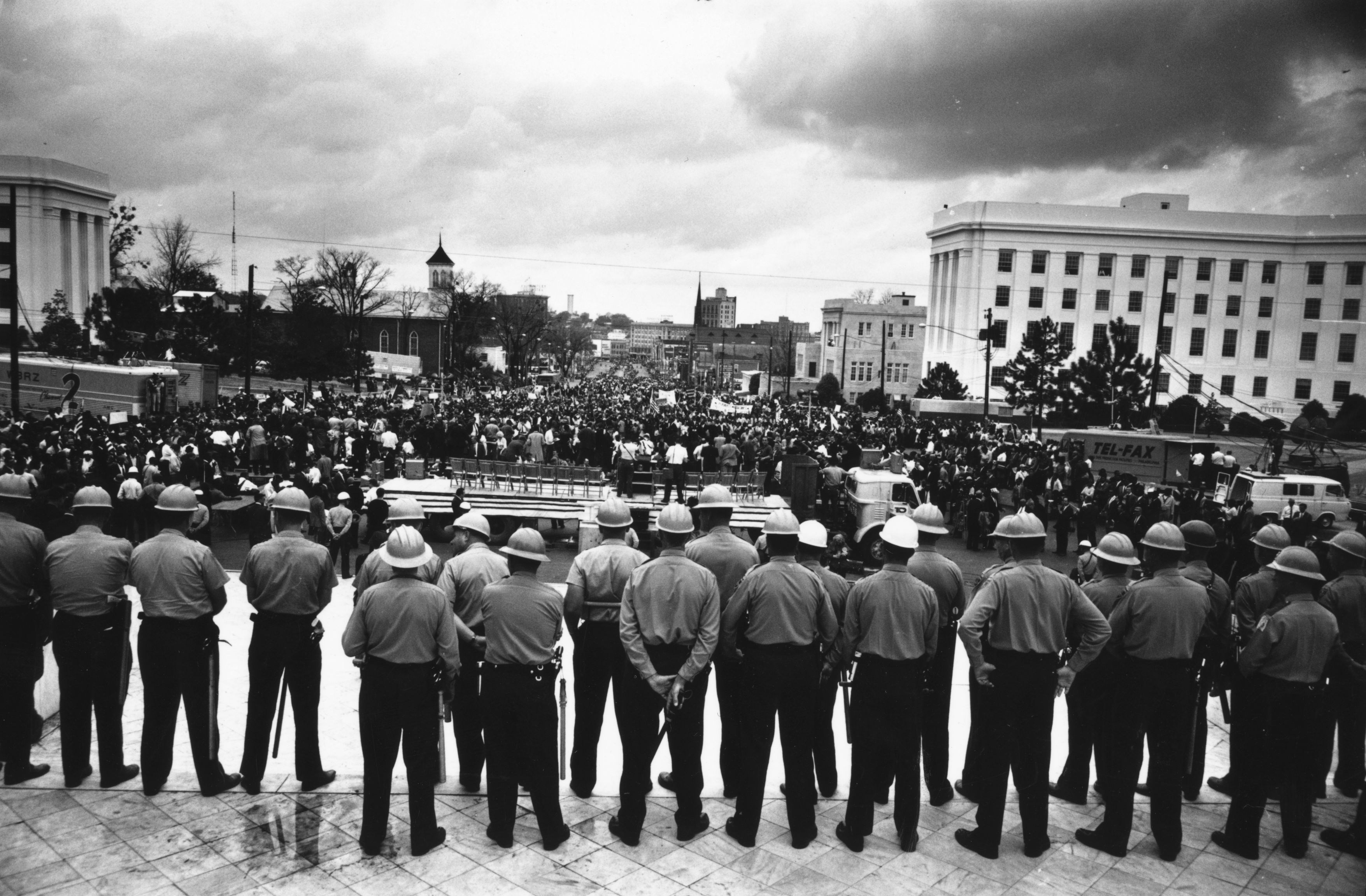March 1965: A line of policemen on duty during a black voting rights march in Montgomery, Alabama. Dr Martin Luther King led the march from Selma, Alabama, to the state capital in Montgomery. (Photo by William Lovelace/Express/Getty Images)