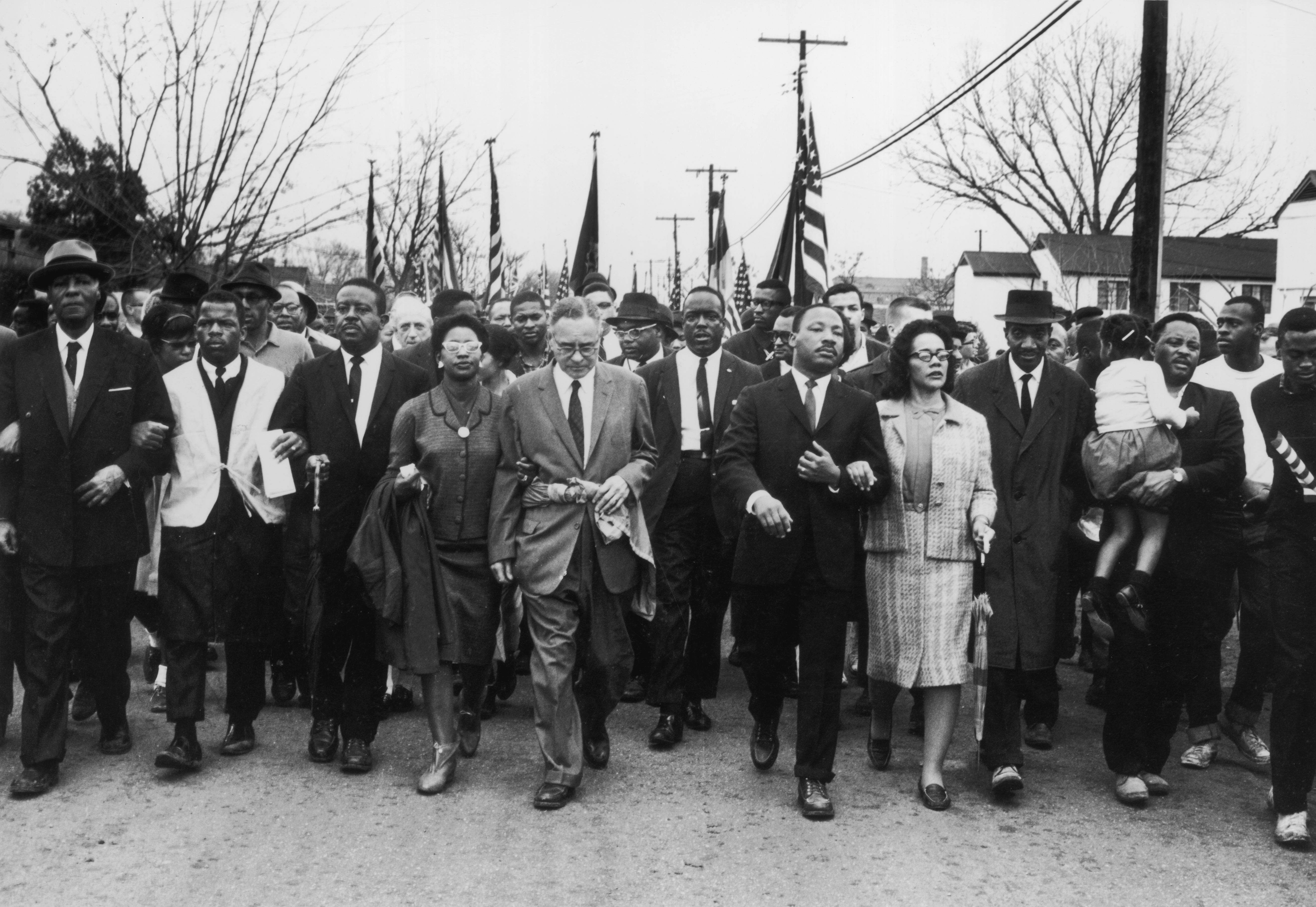 30th March 1965: American civil rights campaigner Martin Luther King (1929 - 1968) and his wife Coretta Scott King lead a black voting rights march from Selma, Alabama, to the state capital in Montgomery. (Photo by William Lovelace/Express/Getty Images)