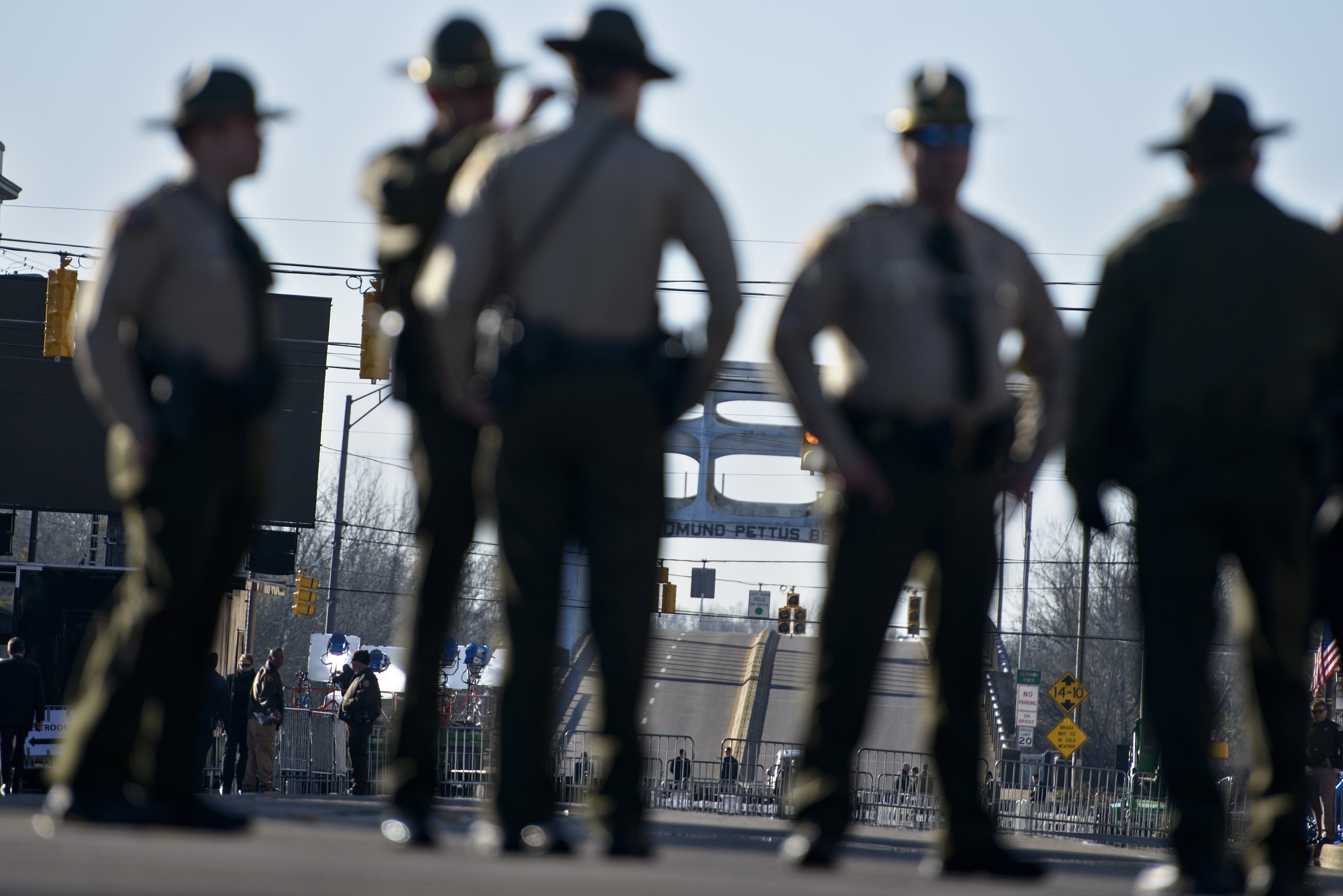 Police officers block Broad Street near the Edmund Pettus Bridge on March 7, 2015 in Selma, Alabama. US President Barack Obama and the first family will visit Selma to commemorate the 50th anniversary of Bloody Sunday, when civil rights marchers attempting to walk to the Alabama capital of Montgomery to end voting discrimination against African Americans clashed with police. AFP PHOTO/BRENDAN SMIALOWSKI (Photo credit should read BRENDAN SMIALOWSKI/AFP/Getty Images)