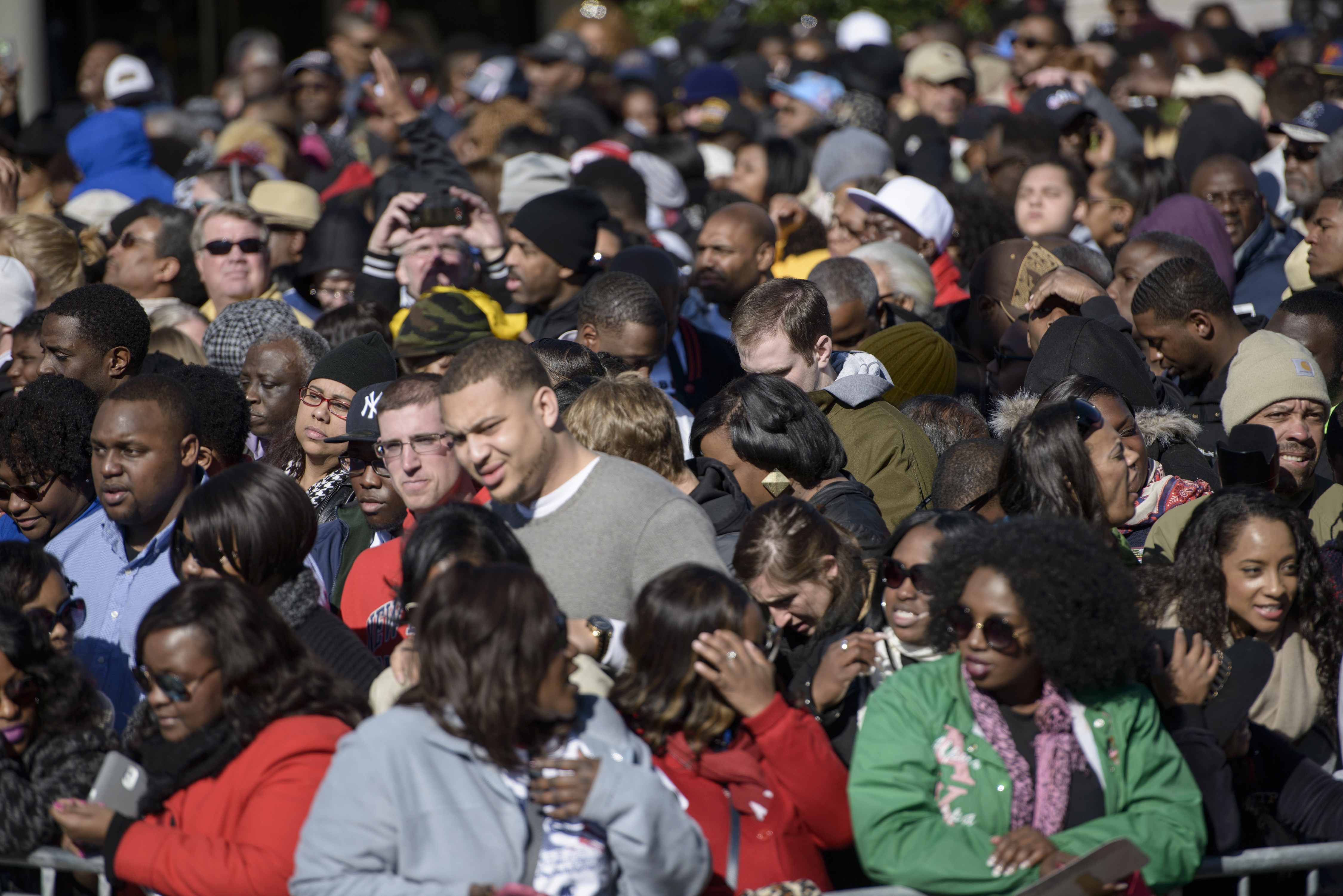 People fill Broad Street while waiting for an anniversary event at the Edmund Pettus Bridge March 7, 2015 in Selma, Alabama. US President Barack Obama and the first family will visit Selma to commemorate the 50th anniversary of Bloody Sunday, when civil rights marchers attempting to walk to the Alabama capital of Montgomery to end voting discrimination against African Americans clashed with police. AFP PHOTO/BRENDAN SMIALOWSKI (Photo credit should read BRENDAN SMIALOWSKI/AFP/Getty Images)