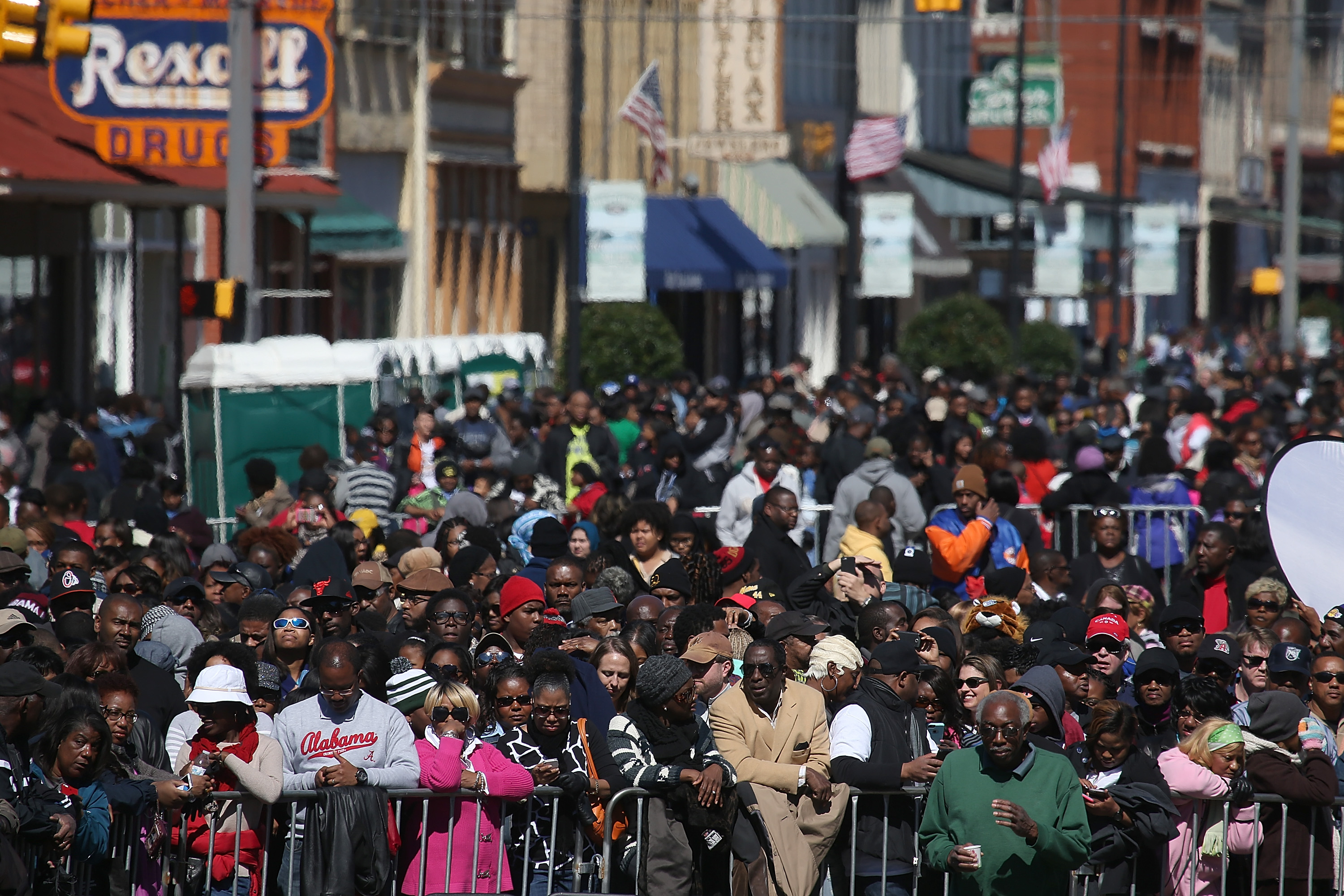 SELMA, AL - MARCH 07: People wait to hear U.S. president Barack Obama speak in front of the Edmund Pettus Bridge on March 7, 2015 in Selma, Alabama. Selma is commemorating the 50th anniversary of the famed civil rights march from Selma to Montgomery that resulted in a violent confrontation with Selma police and State Troopers on the Edmund Pettus Bridge on March 7, 1965. (Photo by Justin Sullivan/Getty Images)