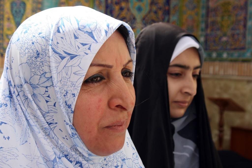 Annual Visit Janan Jezma and her niece Sara are two of many who make an annual pilgrimage to the shrine. “Because I am Muslim, I am Shia, I must come here,” Jezma says. They came to Najaf from Baghdad, about a four-hour drive. Photo by Larisa Epatko