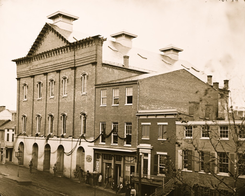 Ford's Theatre, with guards posted at the entrance and crepe draped from windows, circa 1865. Photo by Buyenlarge/Getty Images