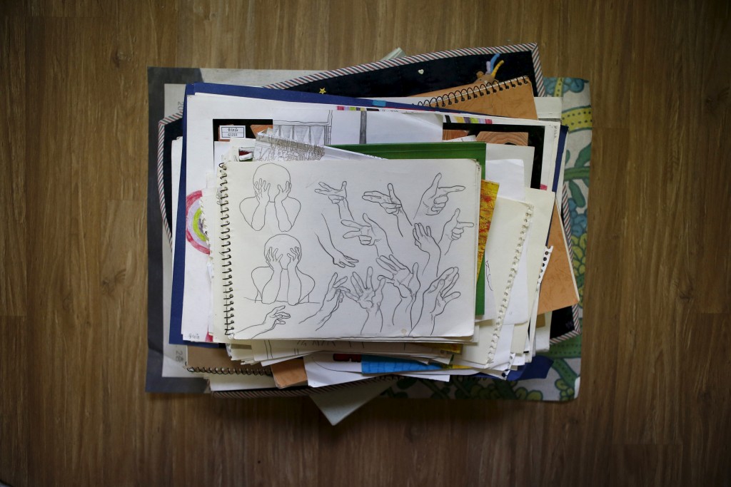 Drawings are piled up in a room belonging to Bin Ha-yong, a high school student who died in the Sewol ferry disaster, in Ansan April 7, 2015. His dream was to be an illustrator. Photo by Kim Hong-Ji/Reuters