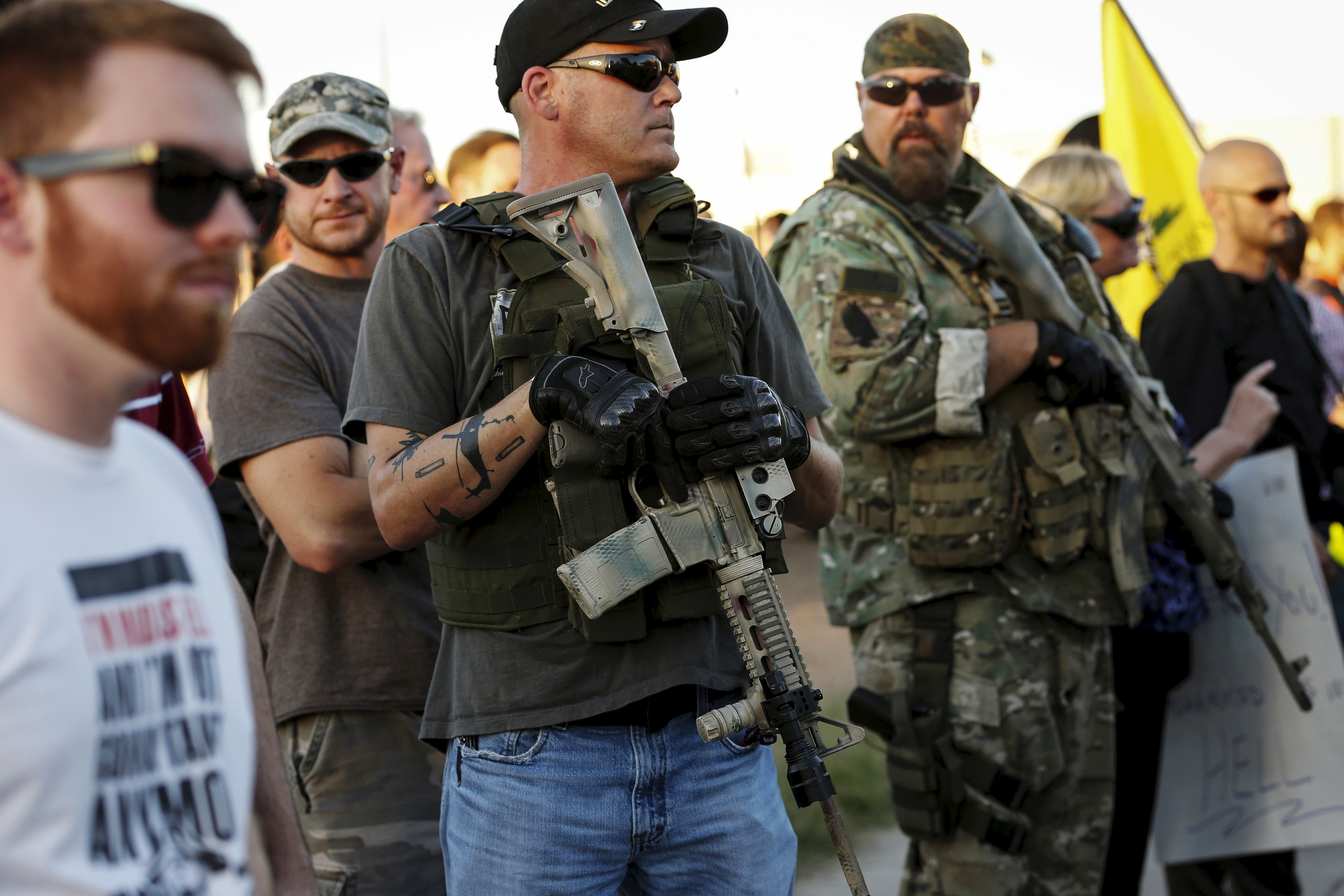 Men carrying rifles attend a "Freedom of Speech Rally Round II" across from the Islamic Community Center of Phoenix, Arizona May 29, 2015. Photo by Nancy Wiechec/Reuters.