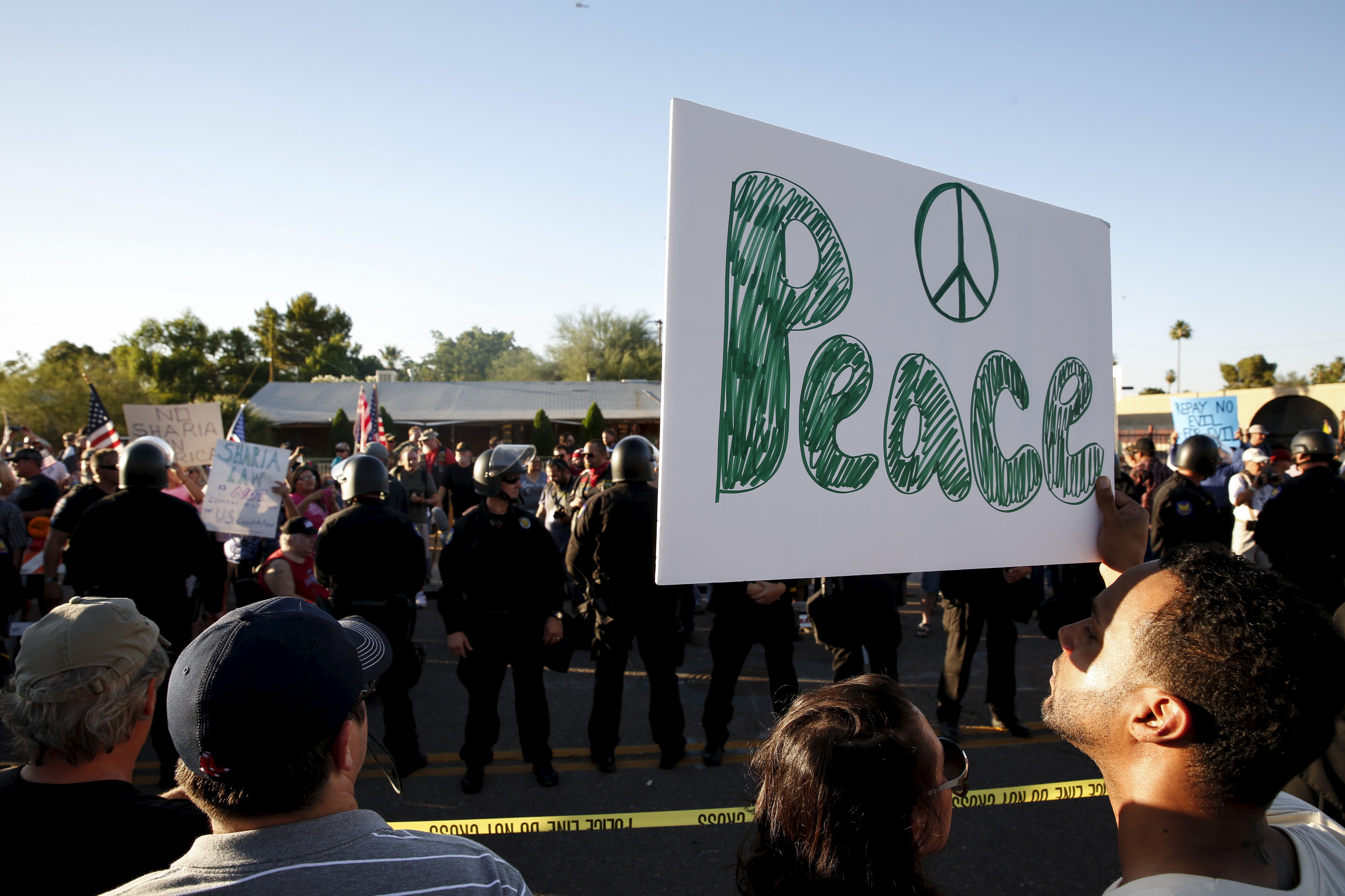 Counter demonstrators look over to those attending the "Freedom of Speech Rally Round II" outside the Islamic Community Center of Phoenix, Arizona May 29, 2015. Photo by Nancy Wiechec/Reuters.