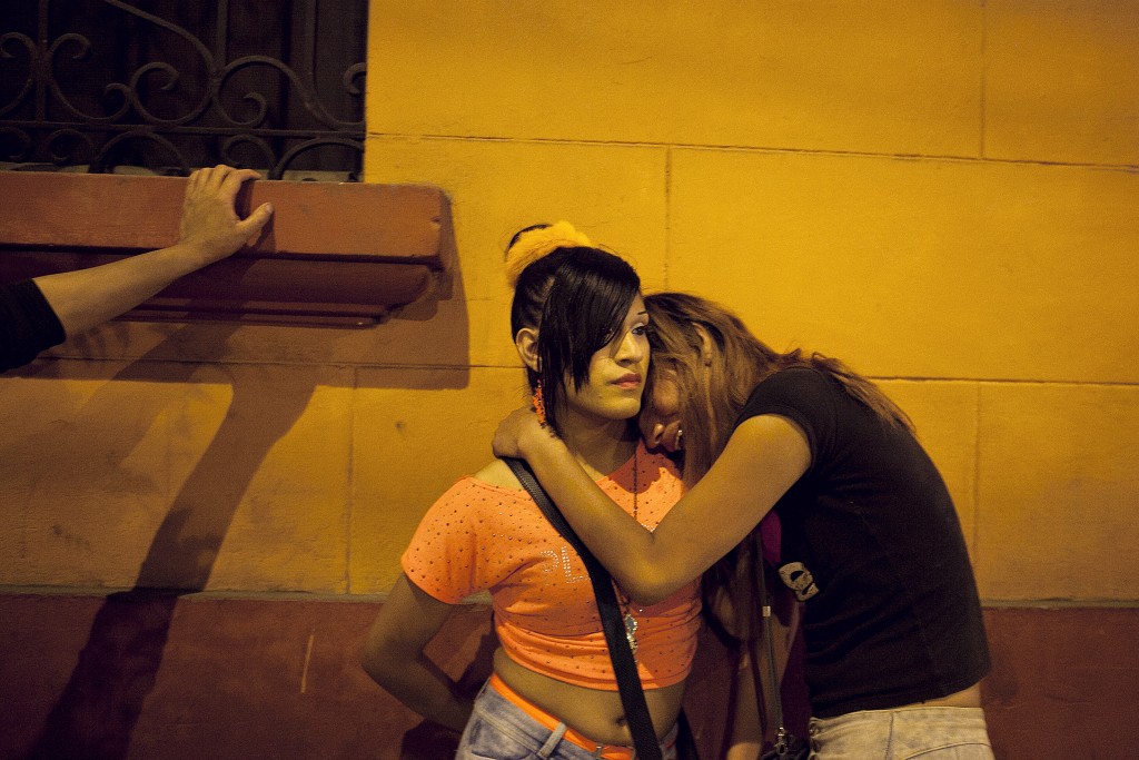 Jordy, left, gives her friend a shoulder to cry on after she found out that her boyfriend was cheating on her with another transwoman. According to anthropologist Ximena Salazar the structures and traditions of gender are very rigid in Peruvian society, thus making it very easy for society to discriminate those who do not fulfill traditional roles. "The family is the first big social space where the female trans is going to have a fight.Ó Because of this constant fight, many leave home and move to Lima where they know there is a network already waiting. [Sex work] is a social world complete with friends and enemies. Their real family rejects them, so their chosen family is also there, said Salazar.