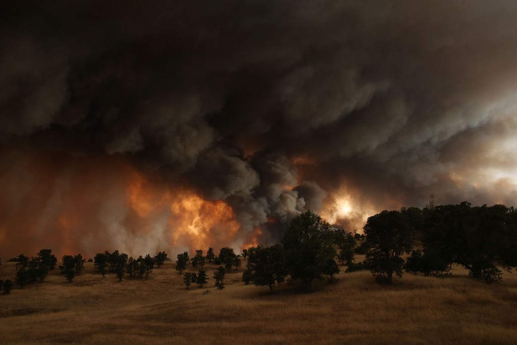 A large plume of smoke rises from the Rocky Fire near Clearlake, CA on Aug. 1, 2015. Photo by Justin Sullivan/Getty Images