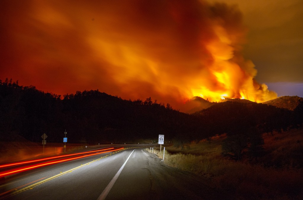 A plume of smoke rises into the air from the Rocky fire near Clearlake, California on August 2, 2015. The fire grew rapidly overnight. Photo by Josh Edelson/AFP/Getty Images