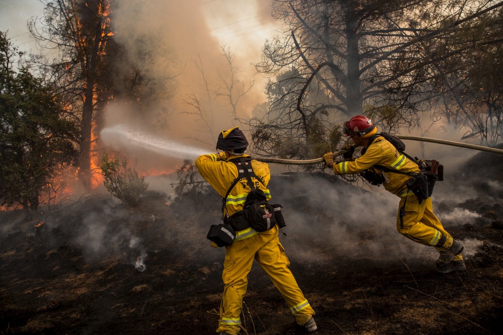 Firefighters race to battle a spot fire at the Rocky Fire in Lake County, California July 30, 2015. Photo by Max Whittaker/Reuters