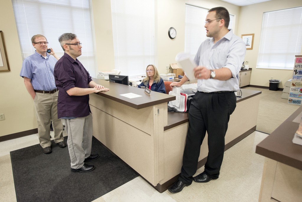 Rowan County Deputy Clerk Nathan Davis, right, informs David Moore, center, and David Ermold, left, that he won't issue them a marriage license on Aug. 13, 2015, at the Rowan County Clerk's office in Morehead, Kentucky. The couple tried for a fourth time Tuesday and were denied again. John Flavell/Lexington Herald-Leader/TNS via Getty Images