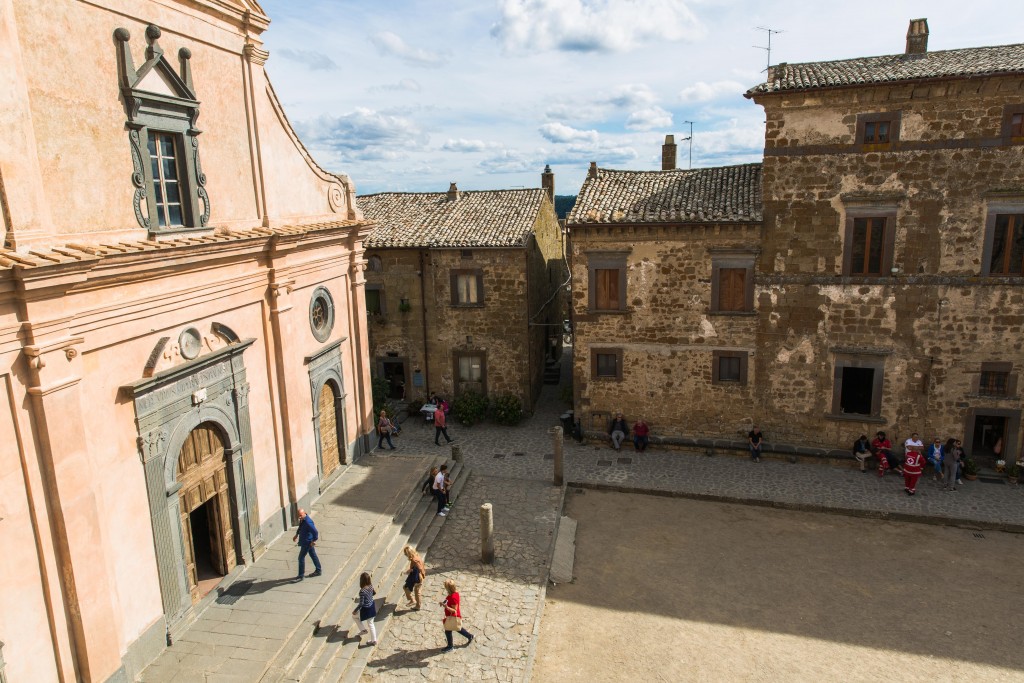 Tourists arrive at the main square of Civita di Bagnoregio, where the San Donato church sits. Photo by Frank Carlson