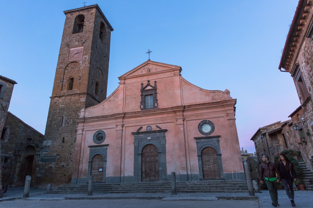 At dusk tourists leave the main square, passing the San Donato church on their way out. Photo by Frank Carlson