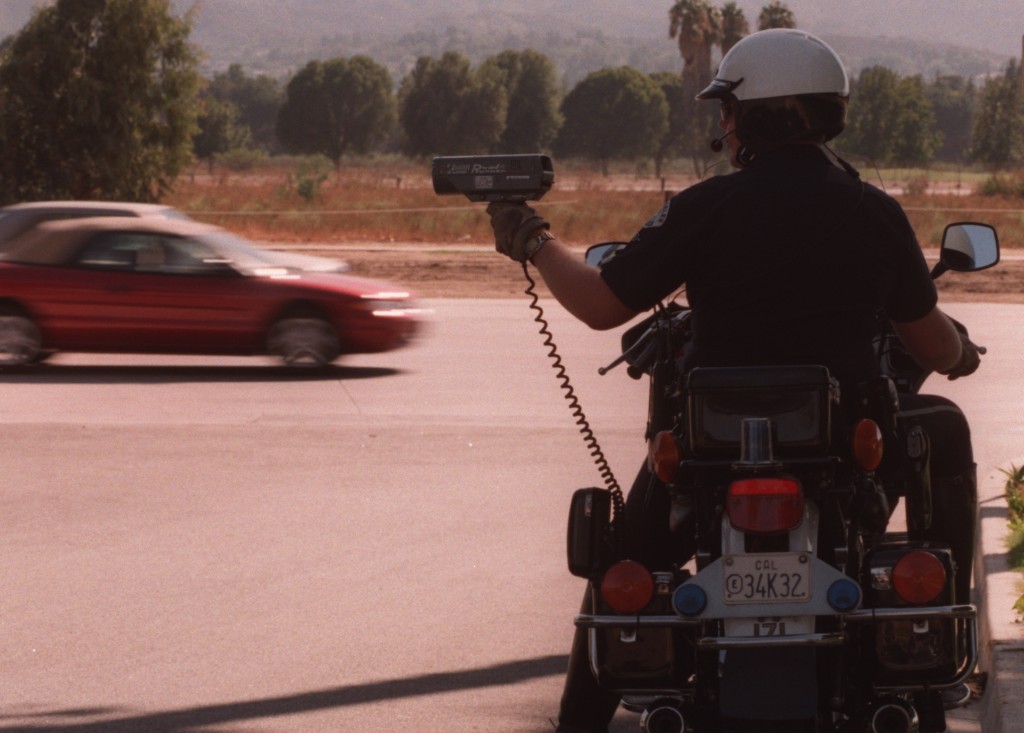 Radar guns rely on relativity to catch speeding cars. Photo by Boris Yaro/Los Angeles Times via Getty Images