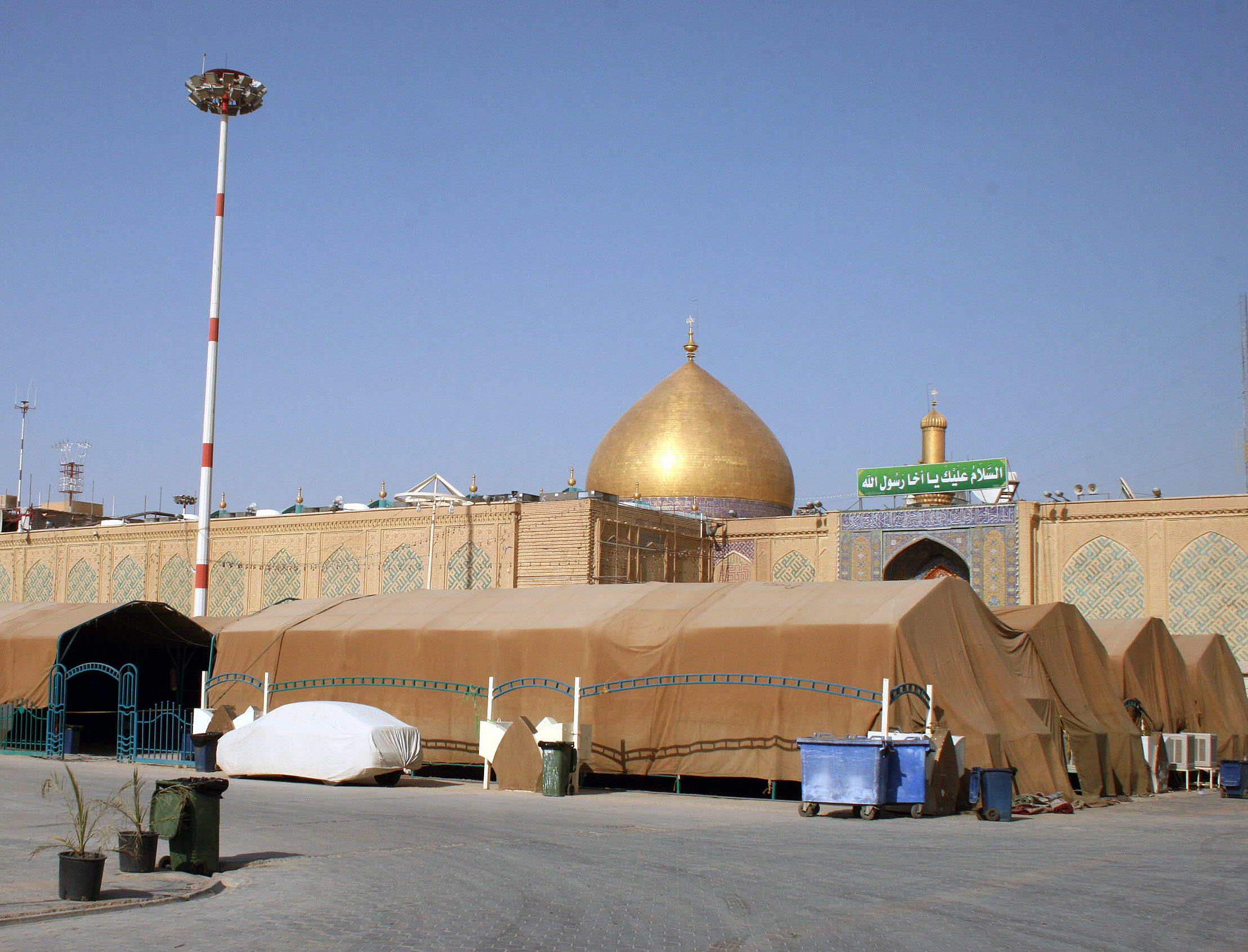 Pilgrims arrive by the busload to pray at the gold-domed shrine. Najaf Gov. Adnan Al-Zurufi told us 1.5 million visitors come each year, more than double the population of the city. Photo by Larisa Epatko