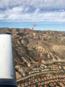 View of natural gas well SS25 in Aliso Canyon and the town of Porter Ranch from Stephen Conley's aircraft, as he measured emissions from the leak. Photo by Stephen Conley