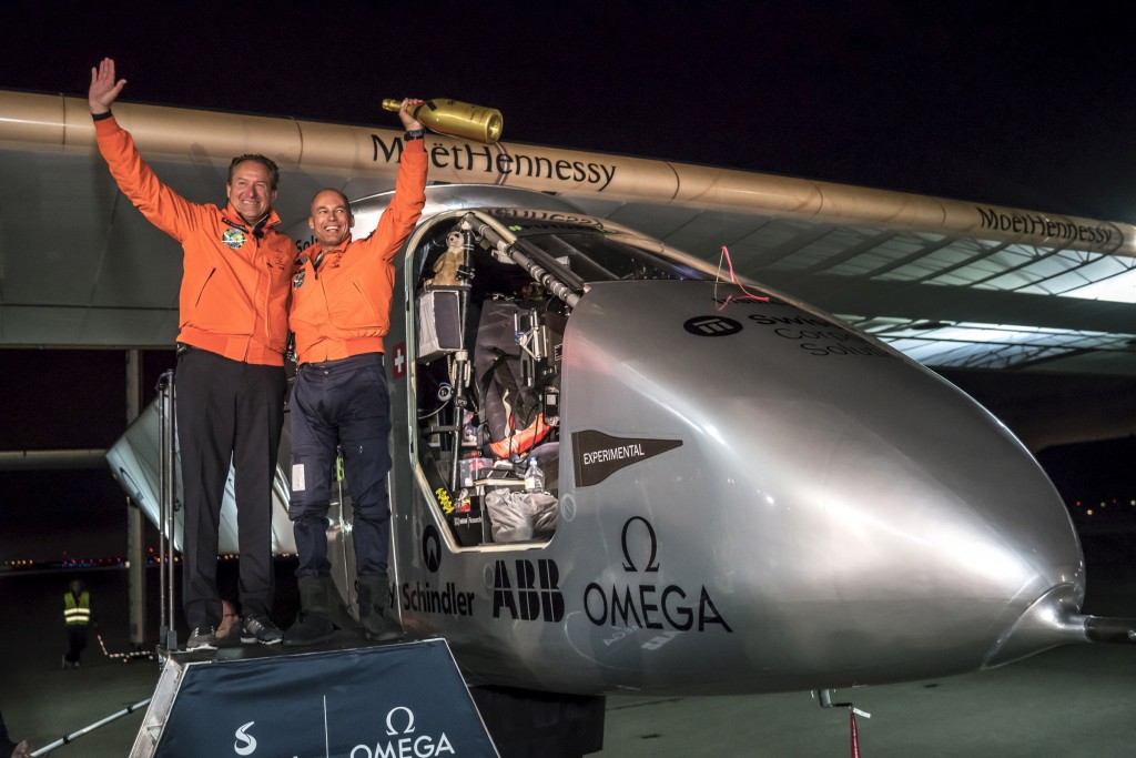 Swiss pilot Bertrand Piccard (R) reacts together with alternate pilot Andre Borschberg after landing "Solar Impulse 2", a solar-powered plane, on Moffett Airfield in Mountain View, California, U.S. April 23, 2016, following a 62-hour flight from Hawaii. Jean Revillard/Solar Impulse/Handout via Reuters
