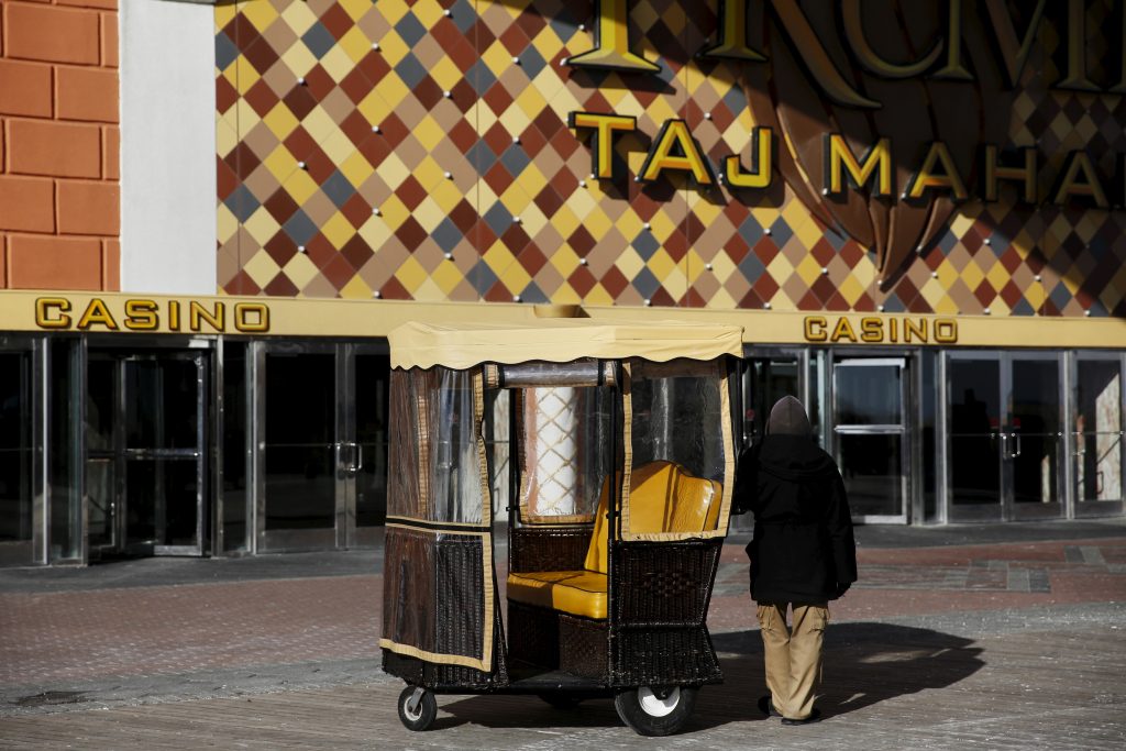 A pedicab driver waits for riders outside the Trump Taj Mahal Casino in Atlantic City, New Jersey. Photo by Shannon Stapleton/Reuters