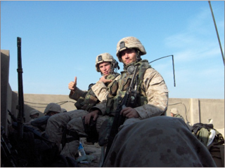 Elliot Ackerman (left) calls in an airstrike during the battle of Fallujah in April 2004. Photo courtesy of Elliot Ackerman