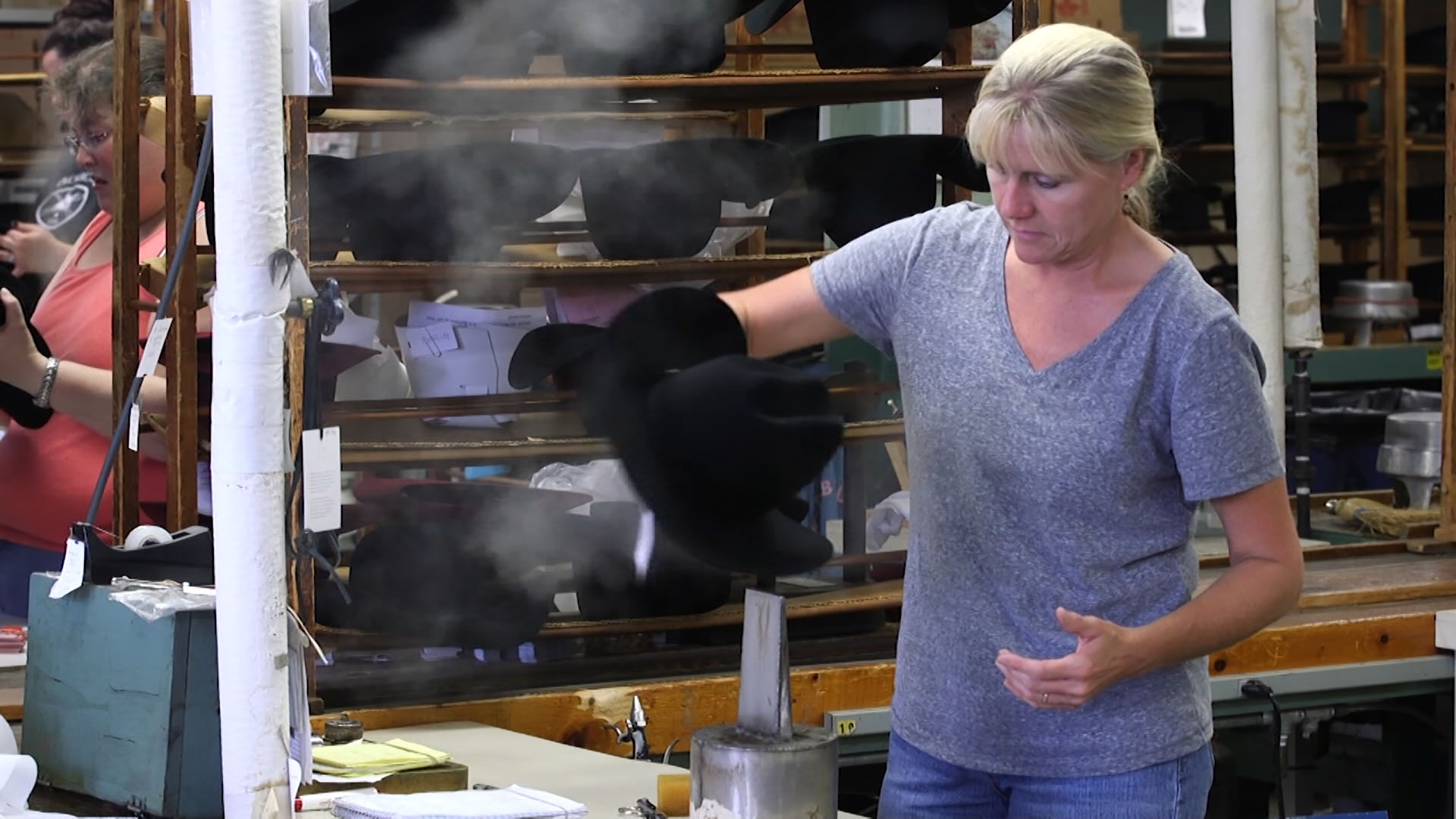 Final inspection of a wool felt Bailey western hat, part of Bollman’s operation dating back to the 1860s. Photo By Connie Kargbo/PBS NewsHour 