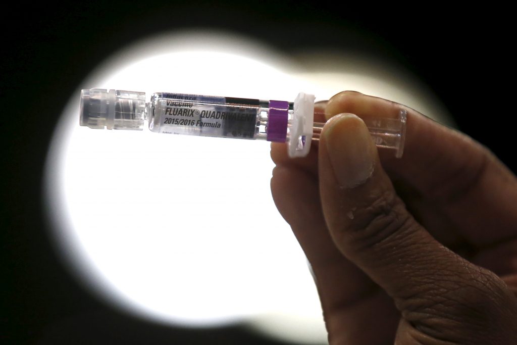 A nurse displays a flu vaccine at a free medical and dental health clinic in Los Angeles, California, U.S., April 27, 2016. Photo by Lucy Nicholson /REUTERS