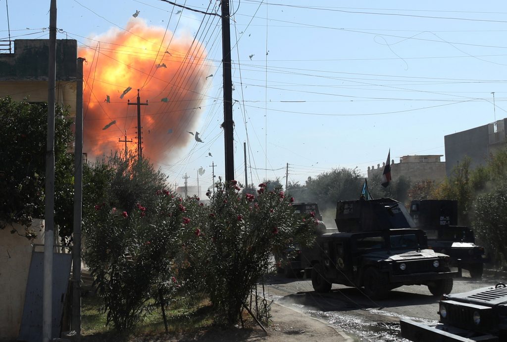 An Islamic State suicide bomber attacks Iraqi special forces soldiers with a car bomb during clashes in Mosul, Iraq. Photo by Goran Tomasevic/Reuters