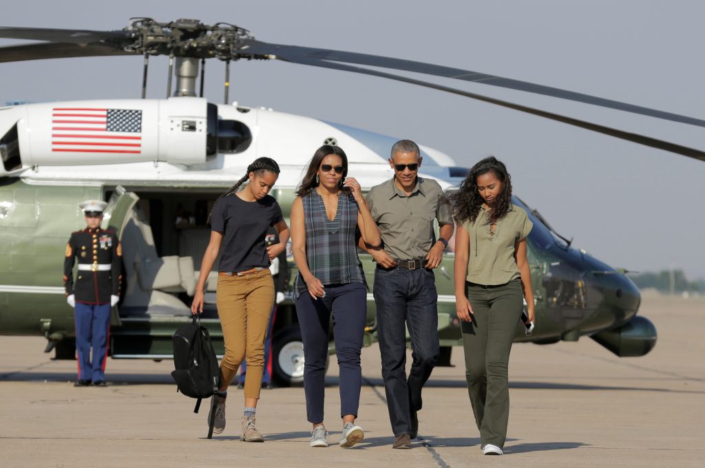 U.S. President Barack Obama and U.S. First Lady Michelle Obama and their daughters Malia (L) and Sasha (R) walk to Air Force One as they depart from Roswell, New Mexico, U.S., June 17, 2016. REUTERS/Joshua Roberts TPX IMAGES OF THE DAY - RTX2GV8R