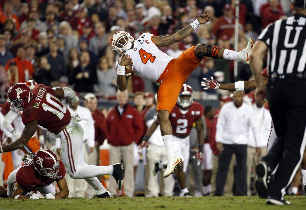 Clemson Tigers quarterback Deshaun Watson (4) is hit short of the first down against the Alabama Crimson Tide during the third quarter in the 2017 College Football Playoff National Championship Game at Raymond James Stadium. Photo by Kim Klement-USA TODAY Sports