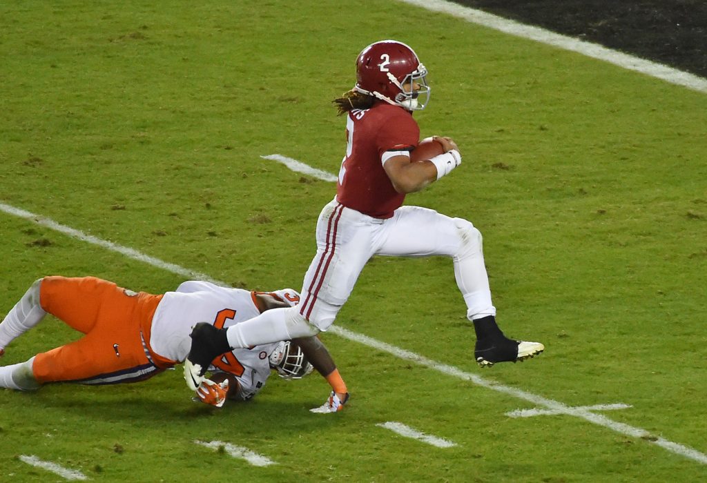 Alabama Crimson Tide quarterback Jalen Hurts (2) scores a touchdown after getting past Clemson Tigers linebacker Kendall Joseph (34) in the fourth quarter in the 2017 College Football Playoff National Championship Game at Raymond James Stadium. Photo by Jasen Vinlove-USA TODAY Sports