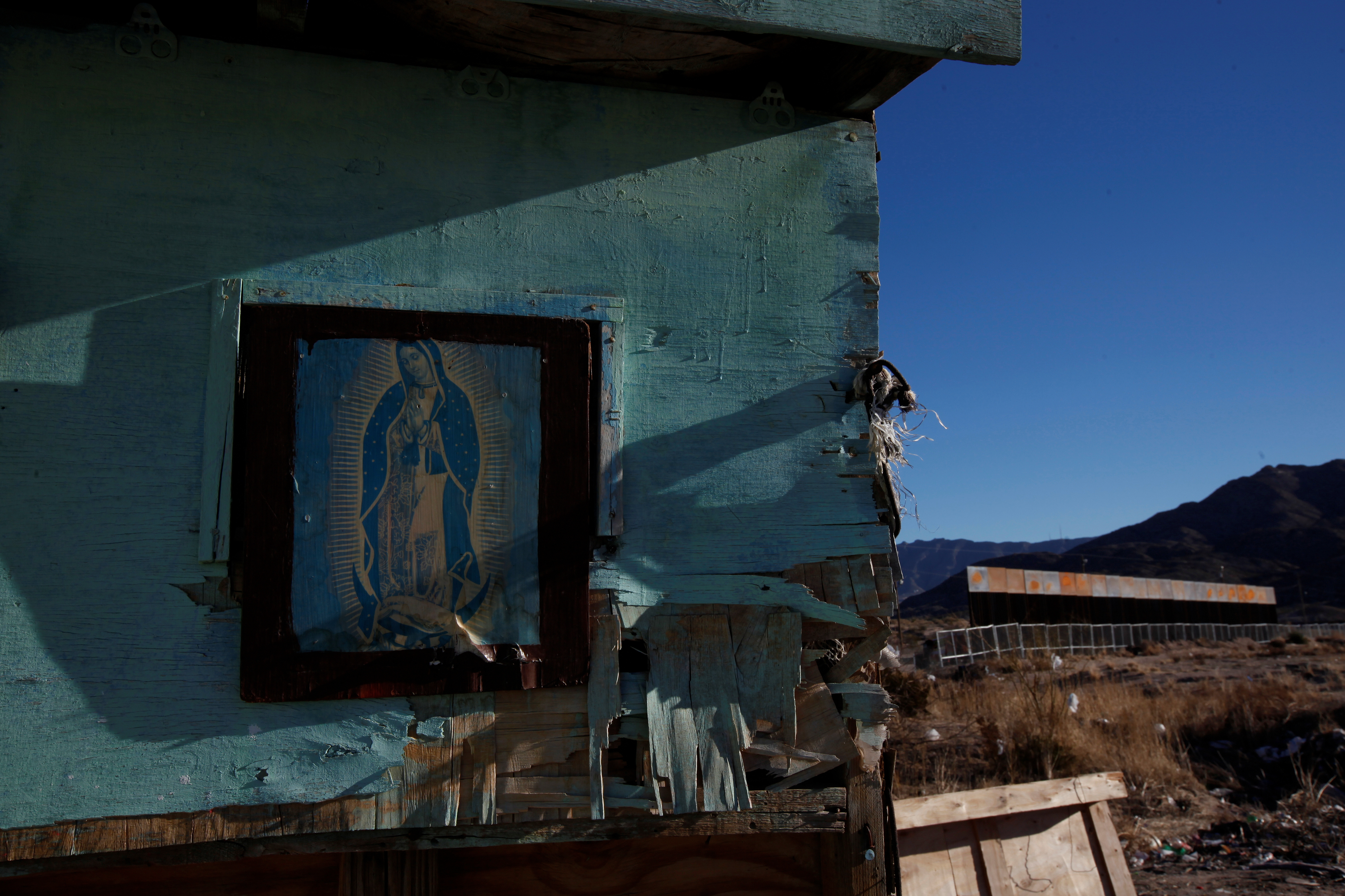 A framed picture of Our Lady of Guadalupe is seen at a house in the Mexican border town of Ciudad Juarez. Photo by Jose Luis Gonzalez/Reuters